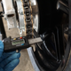 Measuring the master link width.